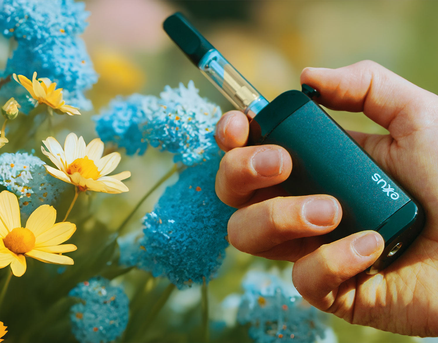 woman holding the Exxus VRS with summer flowers in background